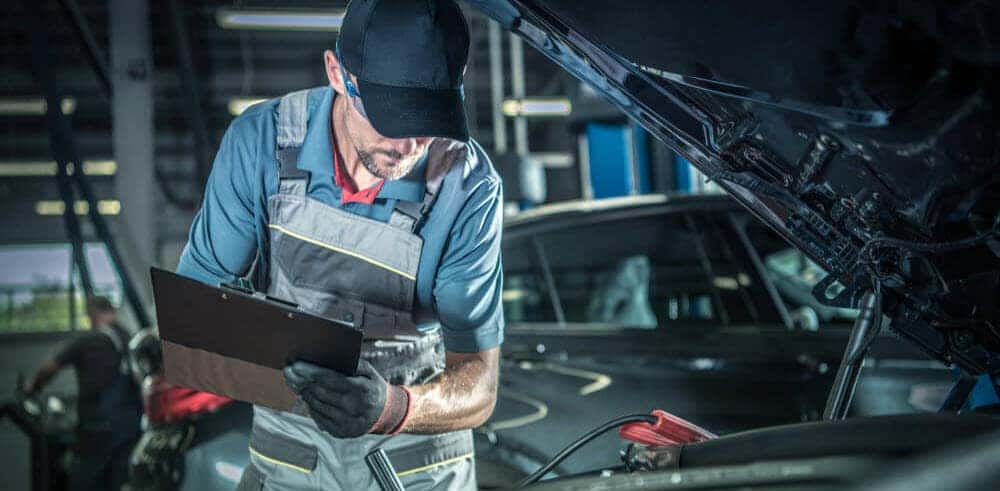 Mechanic Working on Car