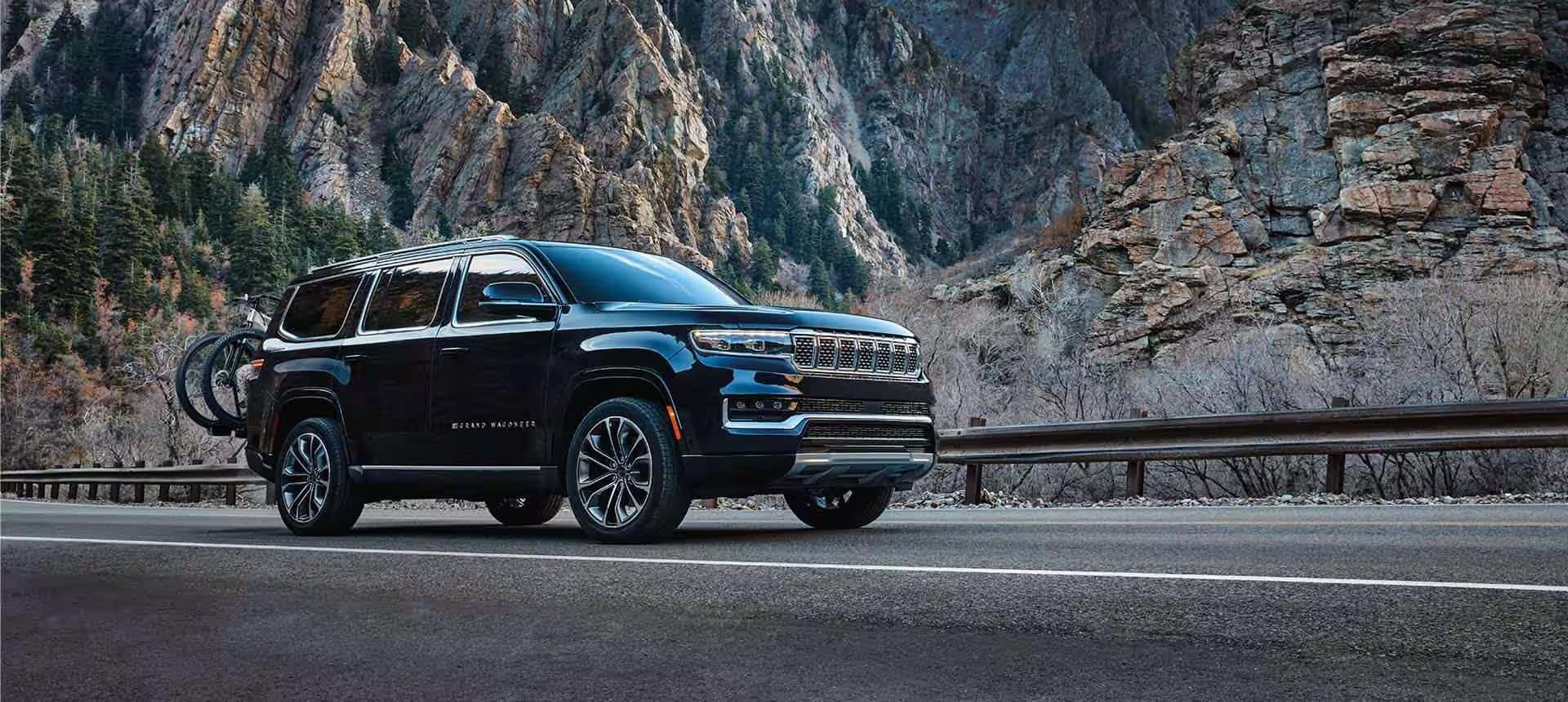 Jeep Wagoneer traveling on a mountain road