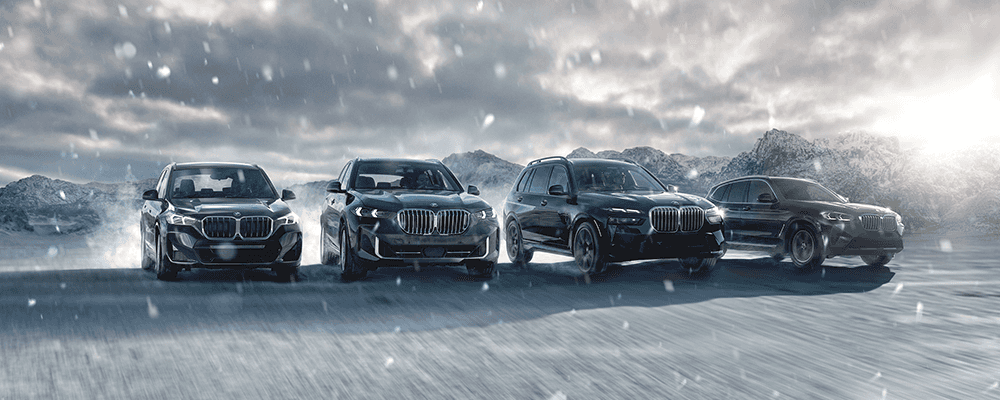 BMW SUV models driving through the snow.