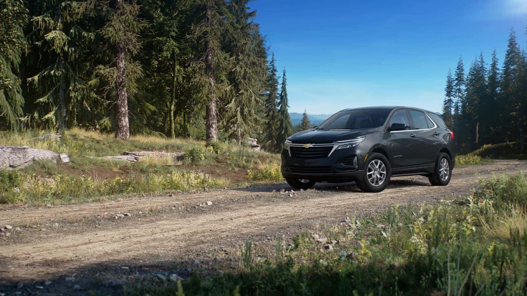 Chevy Equinox driving through the forest mountains