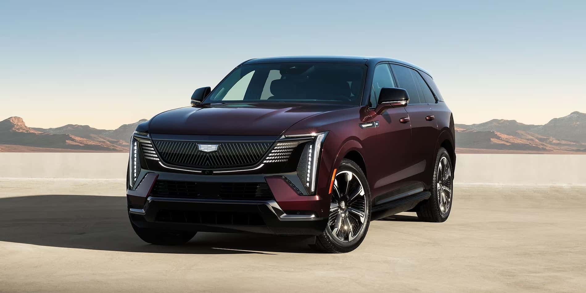 2026 Cadillac Escalade IQ Dark Cherry Metallic Front Three-Quarter View for sale at Covert Cadillac, Austin, Texas