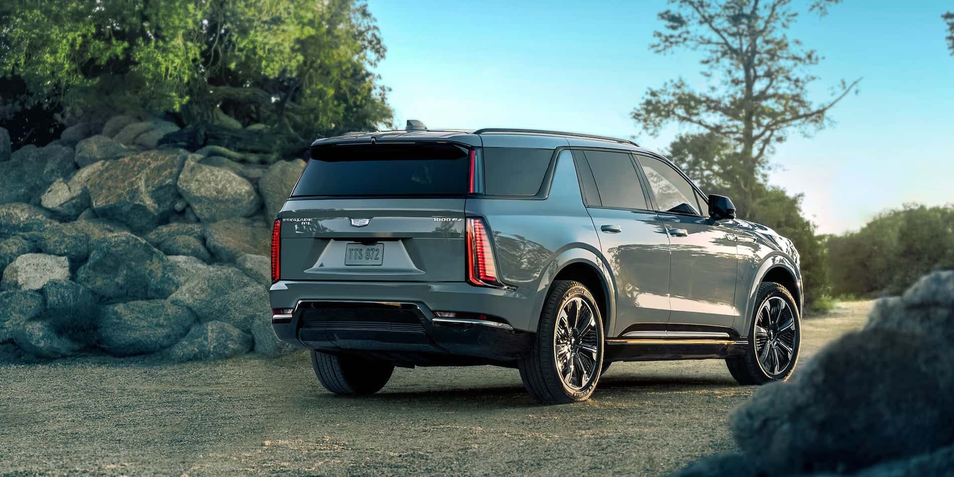 2026 Cadillac Escalade IQL Rear Three-Quarter View in Rocky Terrain for sale at Covert Cadillac, Austin, Texas