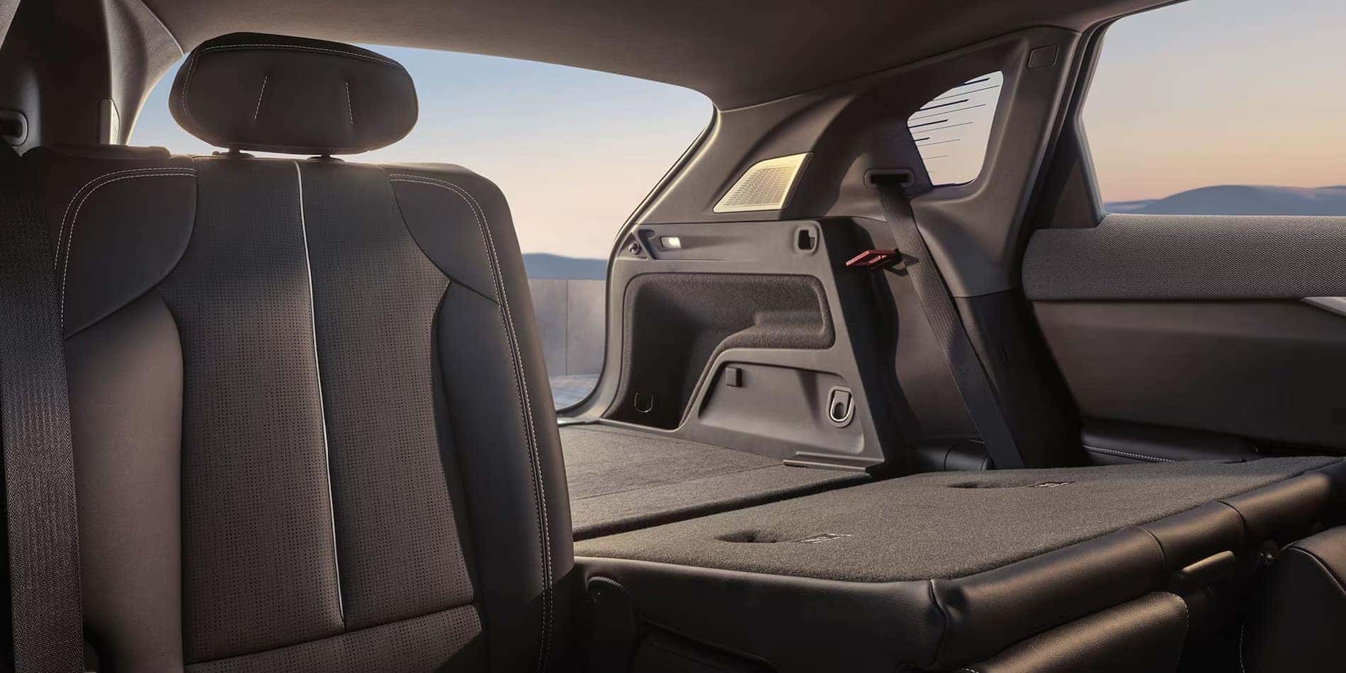 2027 Cadillac OPTIQ rear seats folded, opening the cargo floor