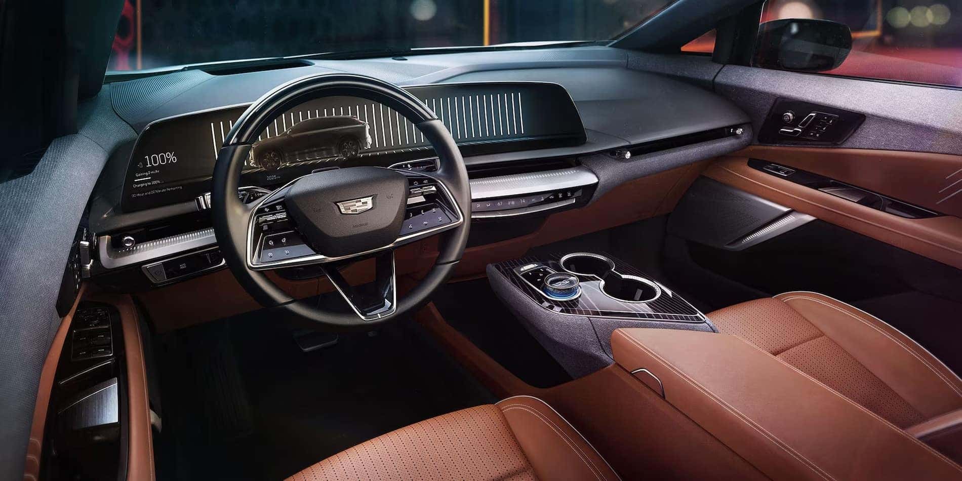 2027 Cadillac OPTIQ steering wheel and tan Inteluxe cabin trim