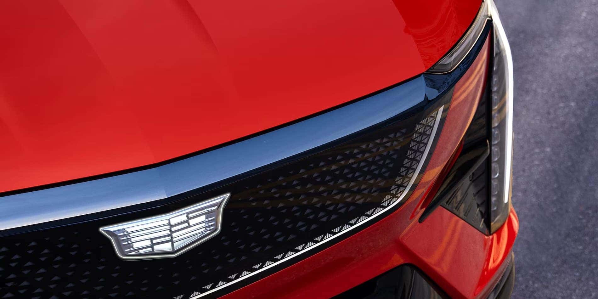 2027 Cadillac OPTIQ grille and headlamp detail in red