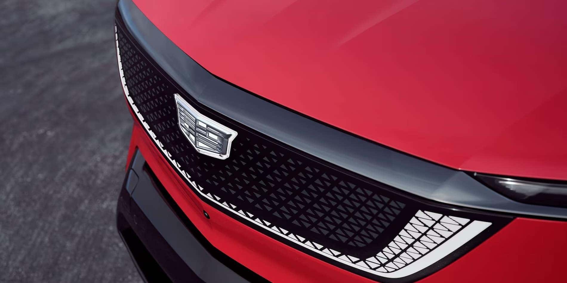 2027 Cadillac OPTIQ illuminated front grille and Crest in red