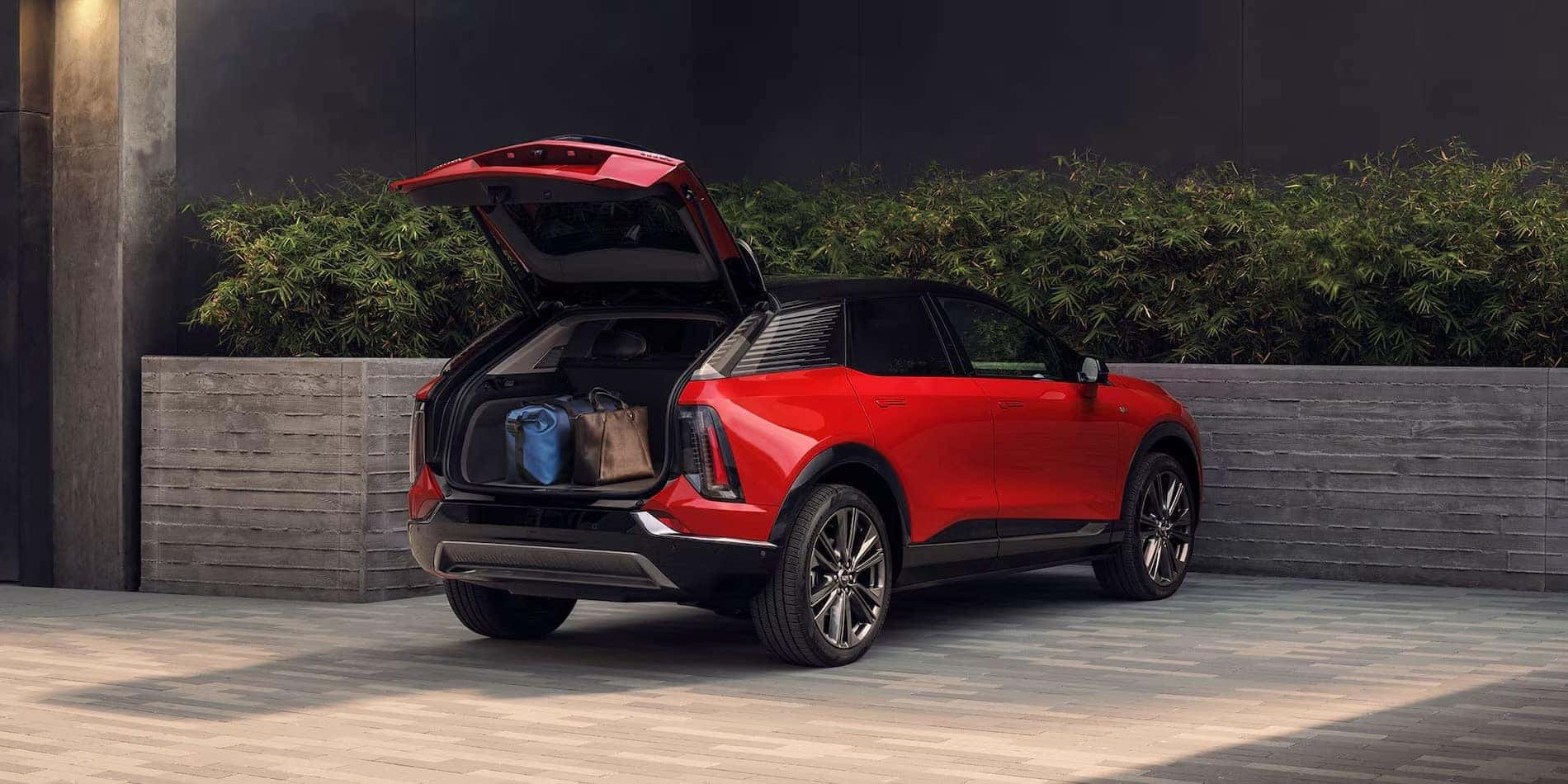 2027 Cadillac OPTIQ with the liftgate open and luggage loaded