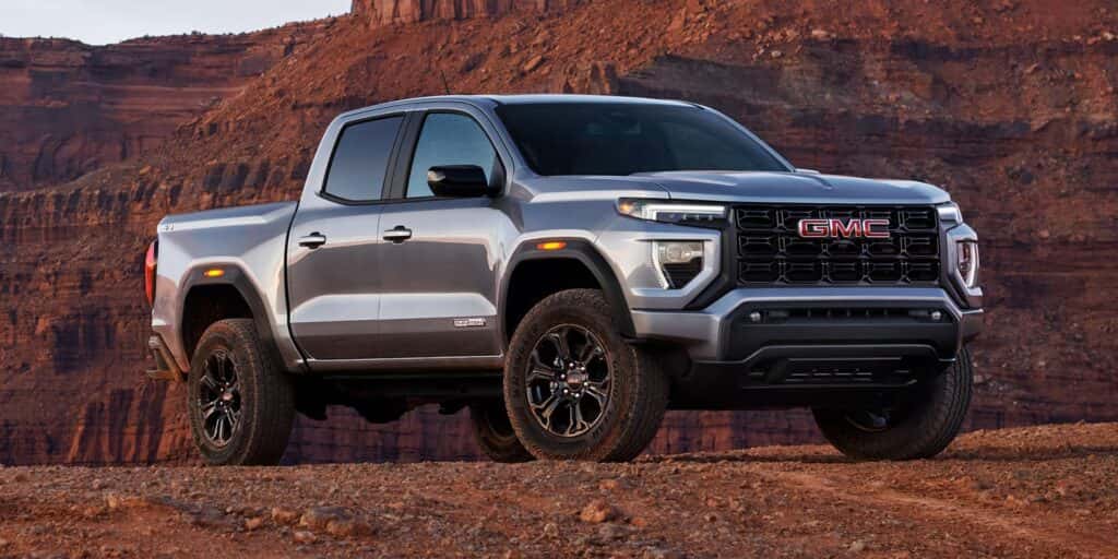 gray 2025 GMC Canyon pickup truck in a canyon