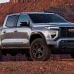 gray 2025 GMC Canyon pickup truck in a canyon