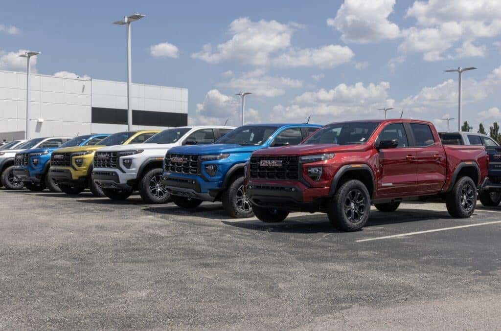 GMC Canyon Mid-Size pickup display at a dealership. GMC offers the Canyon in Elevation, AT4, Denali, and AT4X models.