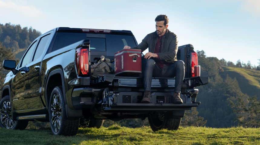 Man sitting on the back of his pickup