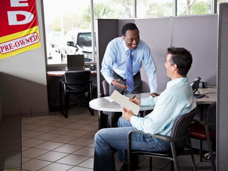 Gallagher GMC sales person working with customer