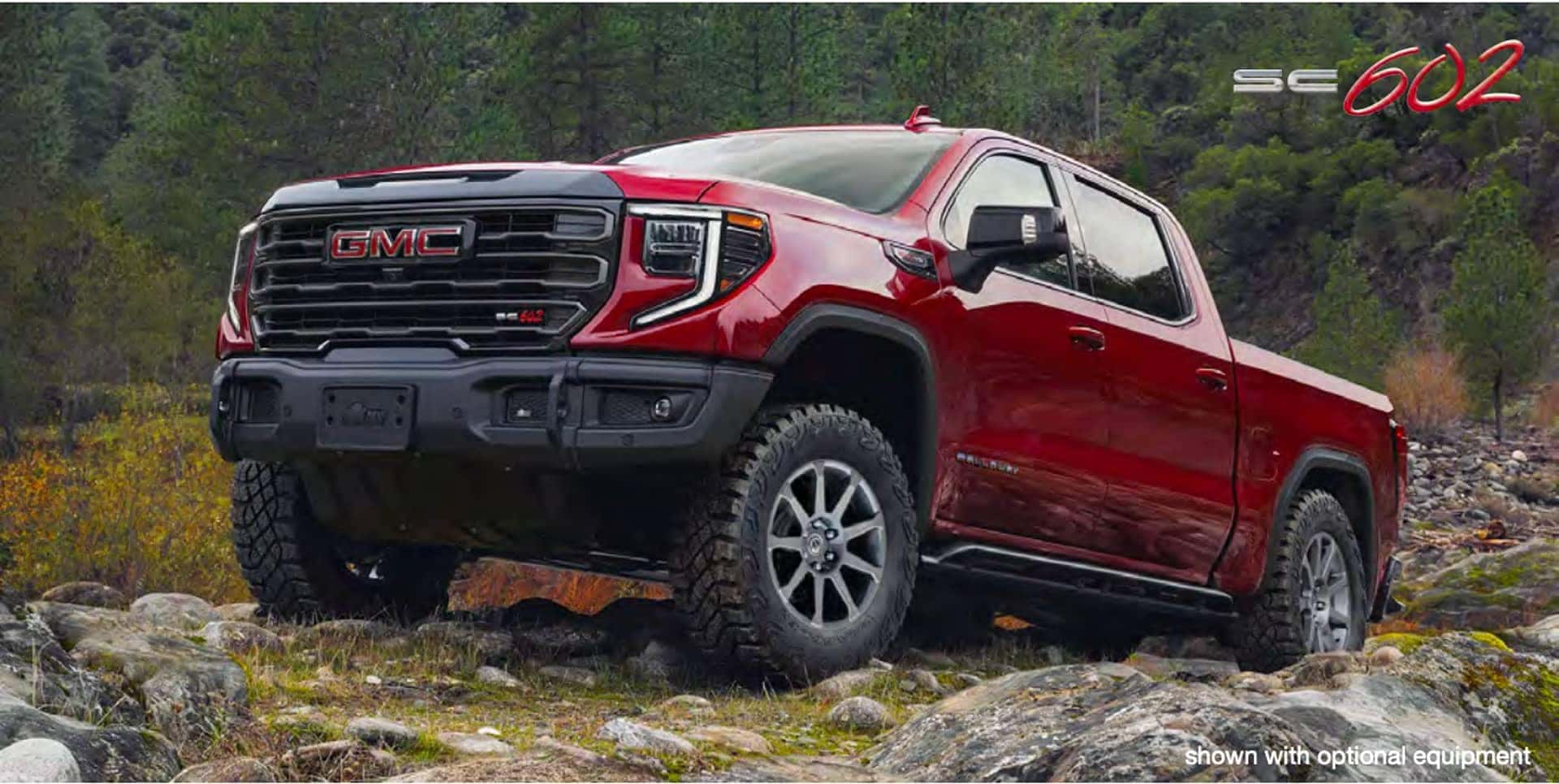 red 2026 Sierra SC602 parked on rocks