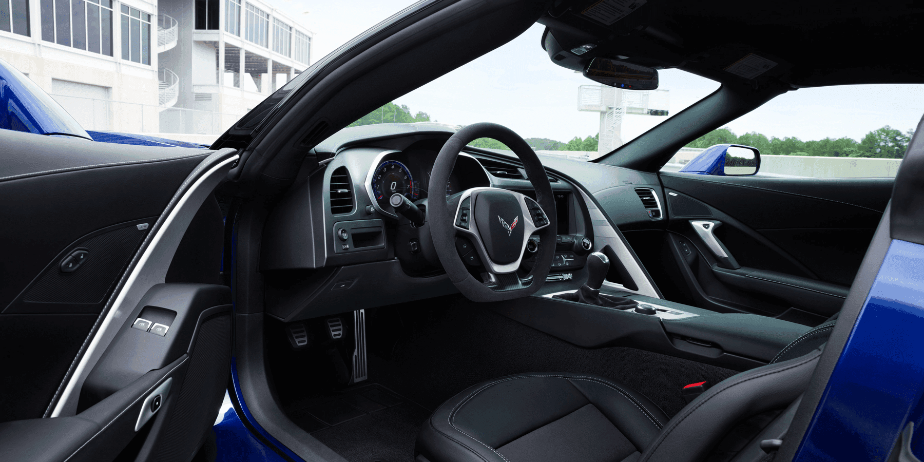 driver's door of Grand Sport opened revealing front seats