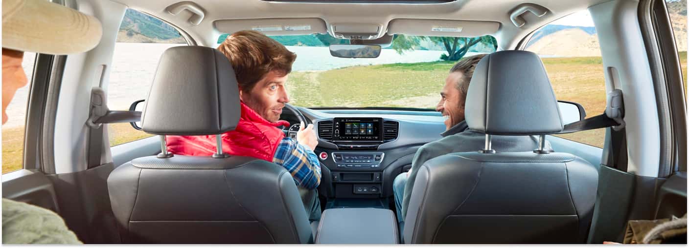 Interior view of a 2026 Honda Ridgeline featuring front-row seating, dashboard touchscreen, and scenic windshield view.