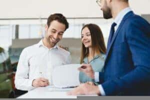 man and woman looking at paperwork