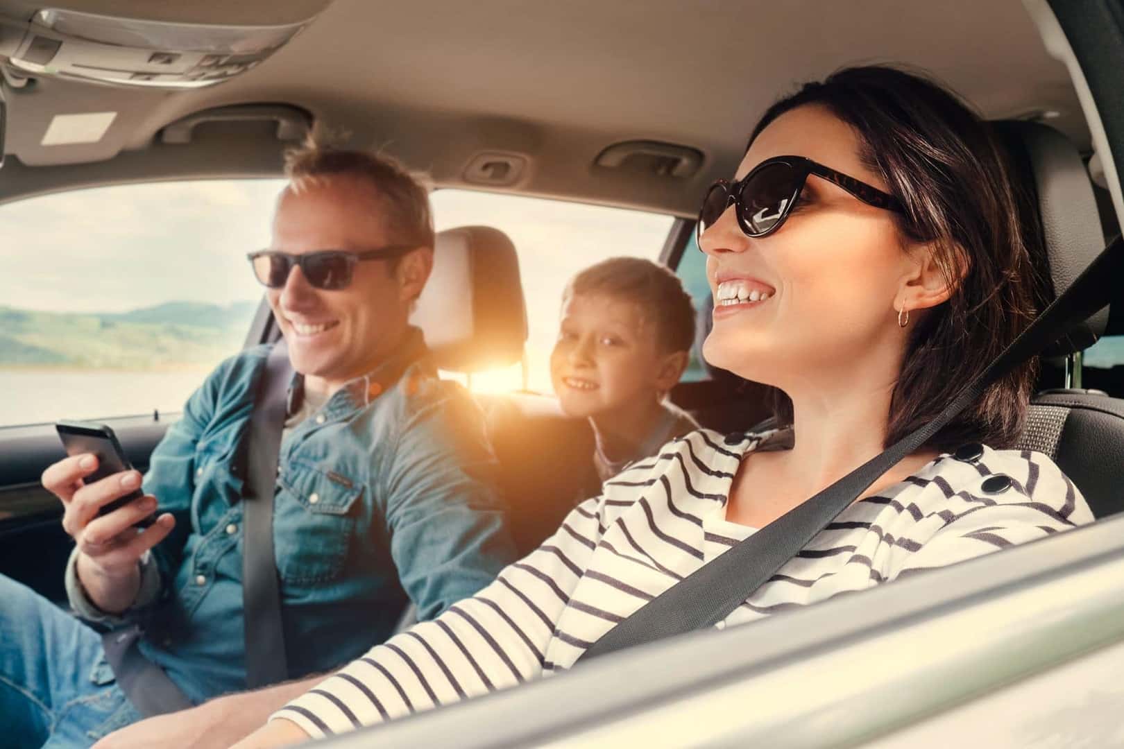 Family Smiling While Driving Around Lynn MA
