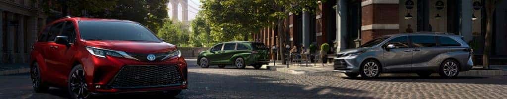 Three new 2021 Toyota Sienna's with green, blue and red exterior paint parked staggered on the road. Get your Sienna lease at Ira Toyota of Danvers today.