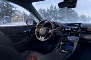 A close up of the dashboard and steering wheel in a new 2021 Toyota Tundra.
