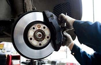 Technician working on brakes