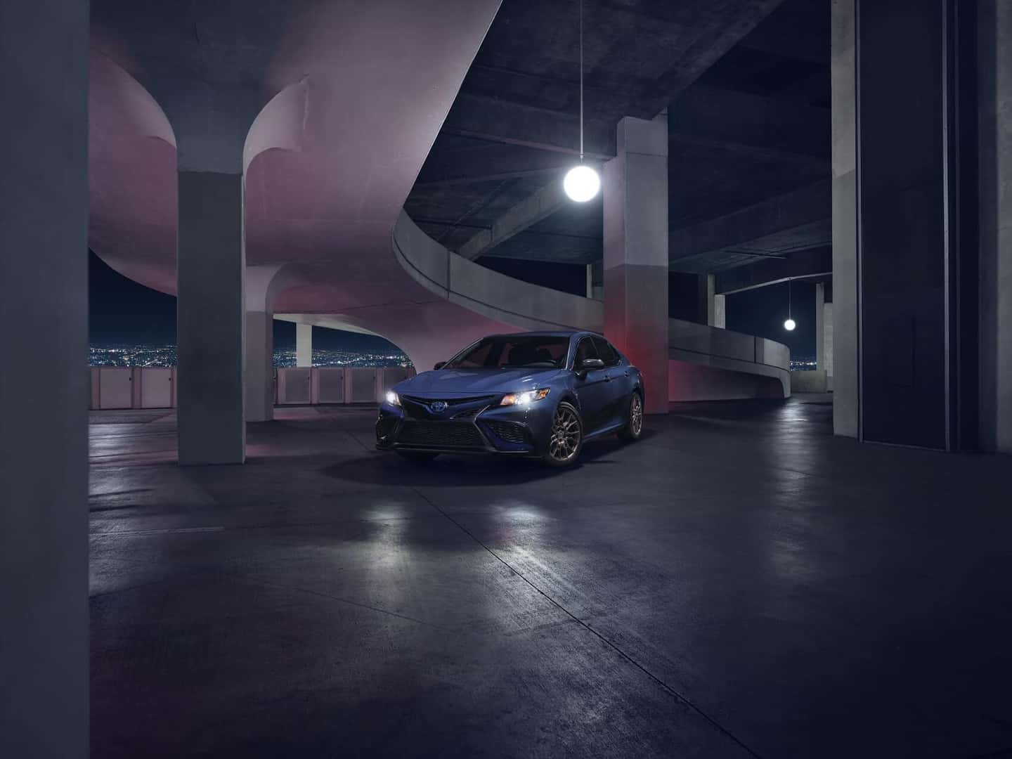 2023 Toyota Camry Hybrid inside a parking garage at night