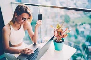 Woman making a purchase on her laptop