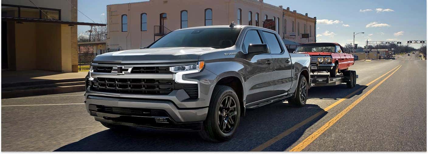 Silver 2026 Chevrolet Silverado 1500 Towing Another Car