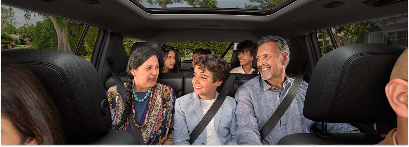 Interior view of the 2026 Chevrolet Traverse featuring three rows of passenger seating and a panoramic sunroof.