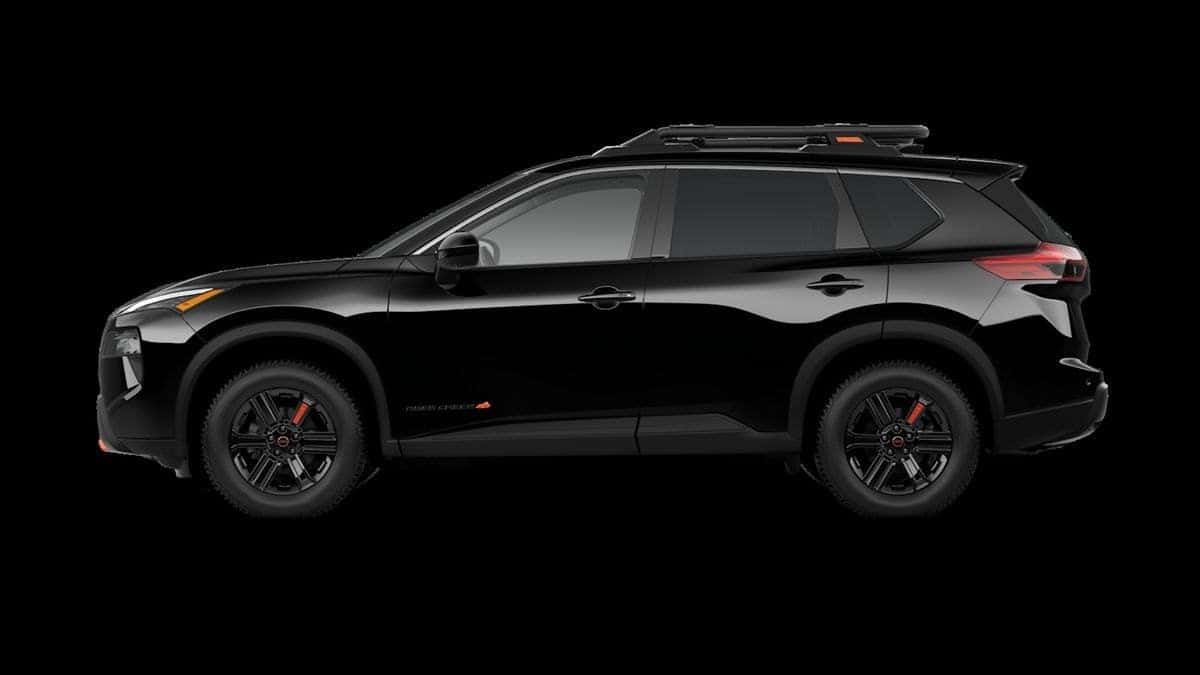 2026 Nissan Rogue Rock Creek exterior, super black, with roof rack and all-terrain tires