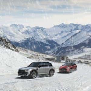 MINI Cooper models driving through snow
