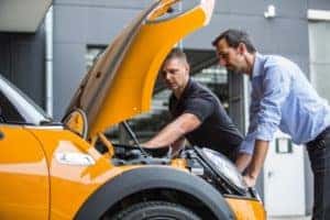 Mechanic inspects a MINI Cooper