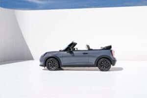 Sleek and stylish 2025 MINI Convertible exterior with a modern grille, LED headlights, and a soft-top roof for open-air driving.
