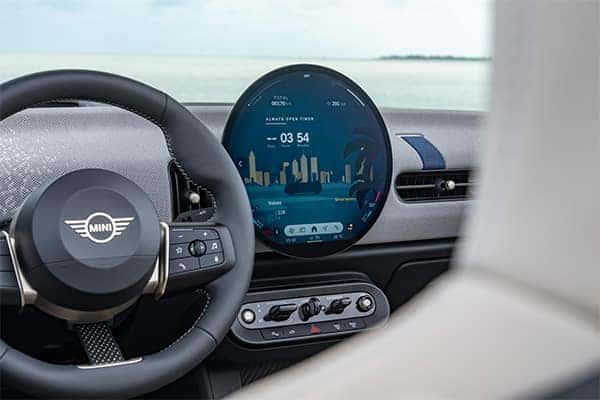 2025 MINI Cooper Convertible interior showcasing premium materials, digital dashboard, and comfortable seating