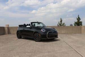 2026 MINI Cooper Convertible displayed at Patrick MINI, featuring its sleek design, open-top roof, and sporty styling