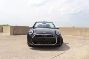 Patrick MINI dealership team helping a customer explore new MINI models, showcasing friendly service and a premium car-buying experience