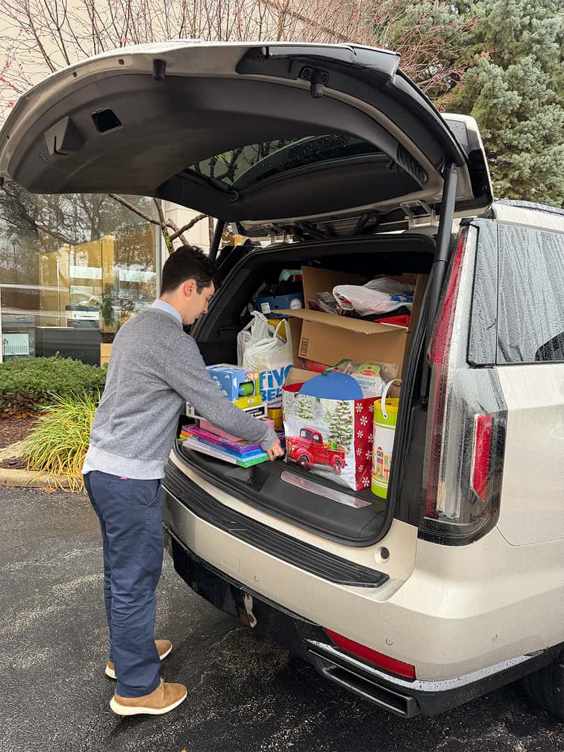 Patrick MINI team donating toys at the Schaumburg Holiday Toy Drive.
