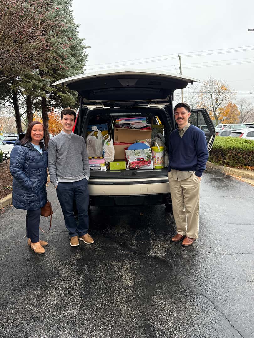 Patrick MINI employees delivering gifts for the Schaumburg Holiday Toy Drive.