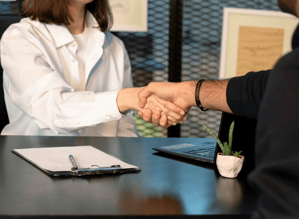 Tuscaloosa Toyota team shaking hands with a customer