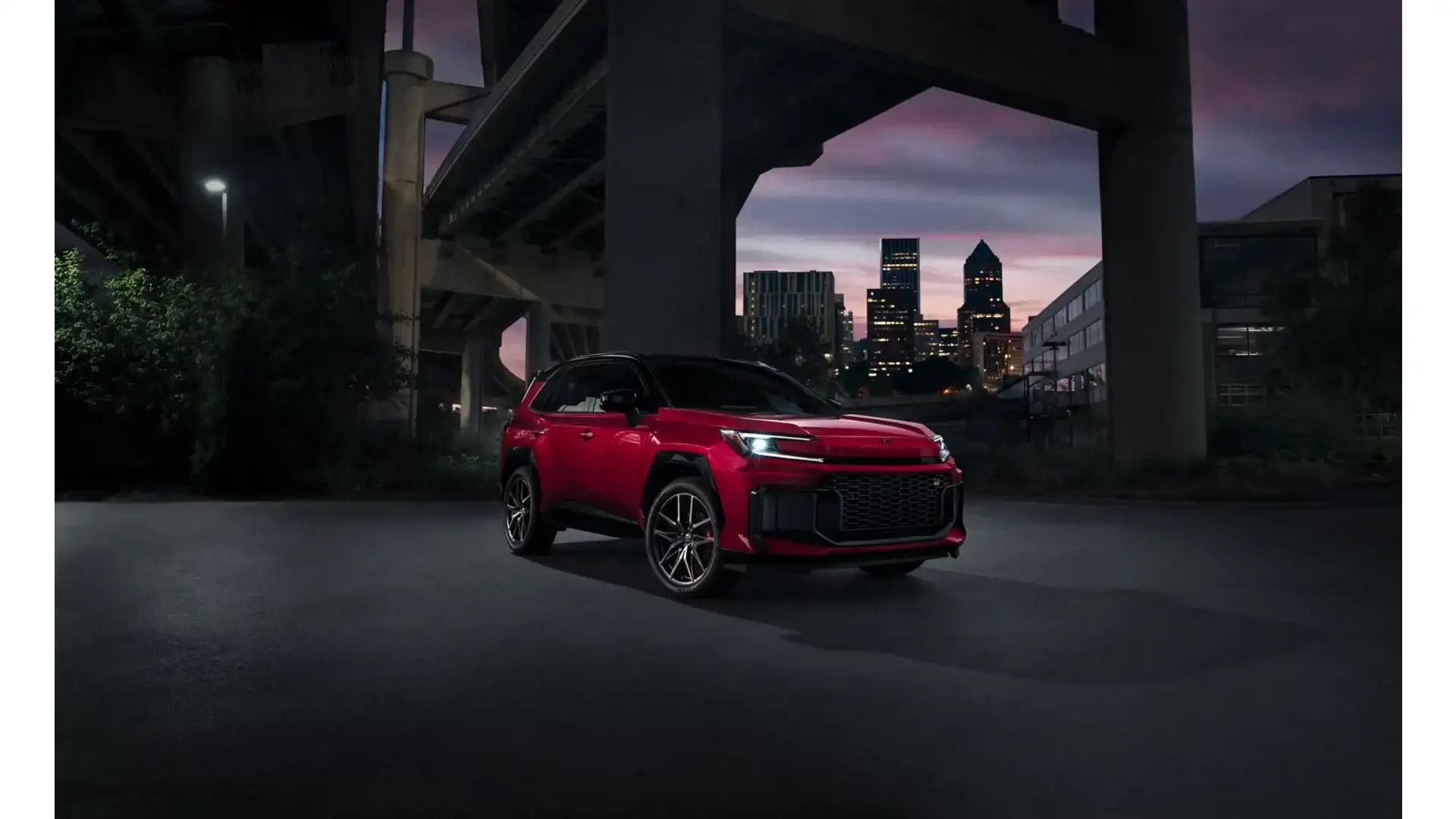 2026 Toyota RAV4 Plug-in Hybrid GR SPORT in a city at dusk
