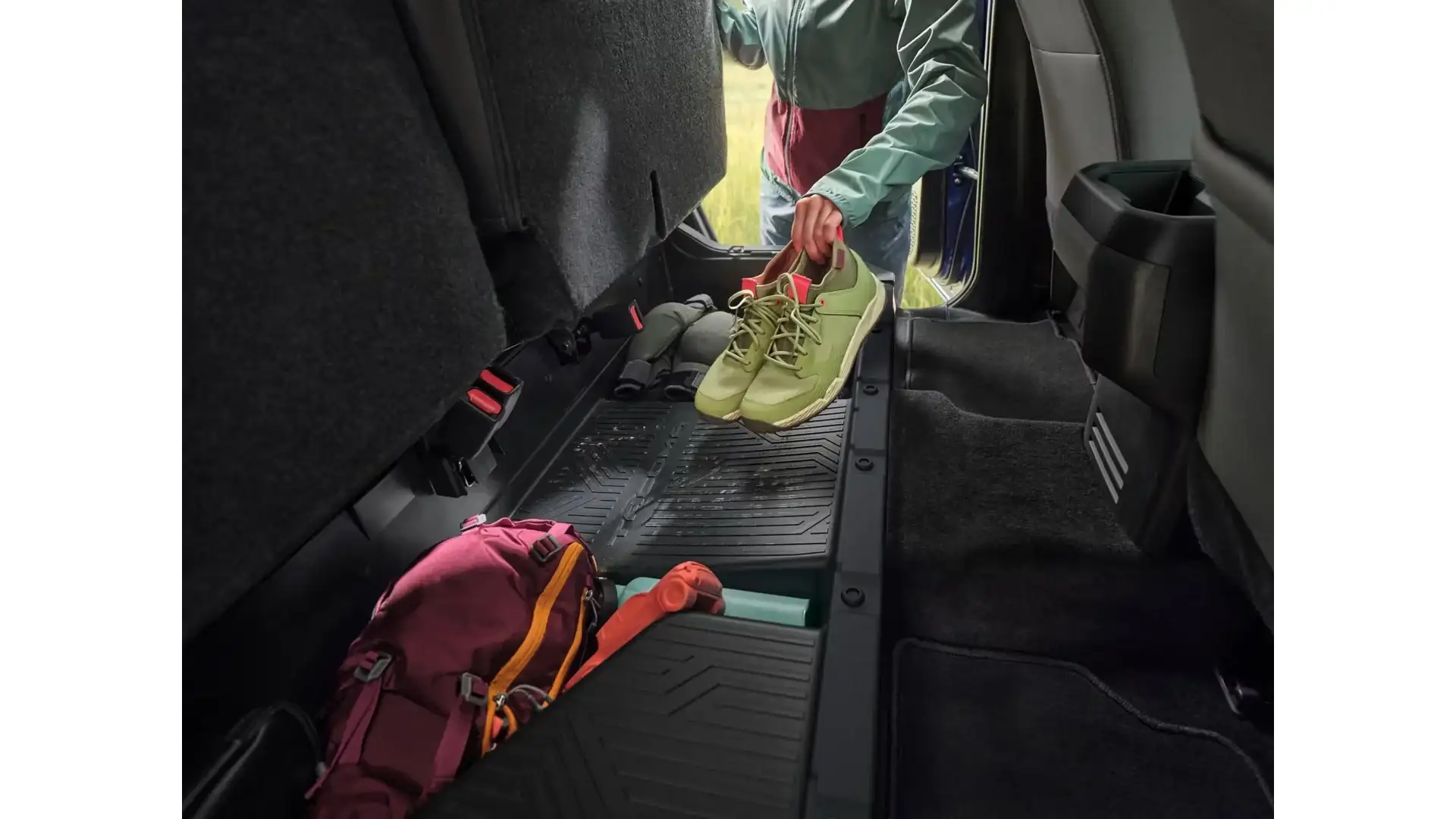 2026 Toyota Tacoma TRD Sport rear seat under-storage with gear loaded in
