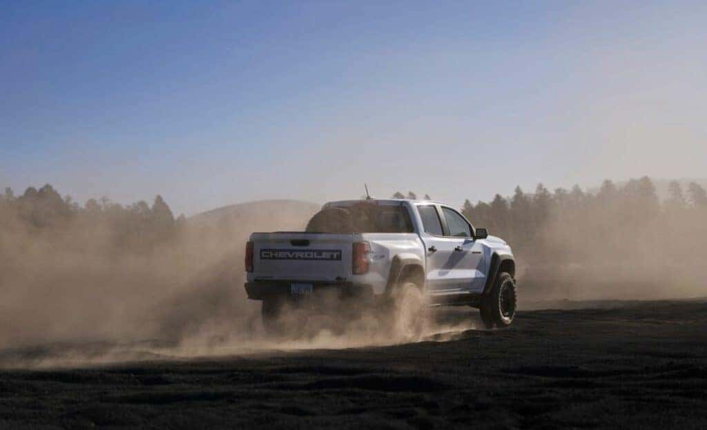 Rear 3/4 view of the Colorado ZR2 Bison with a spare tire in the carrier in the bed of the truck.