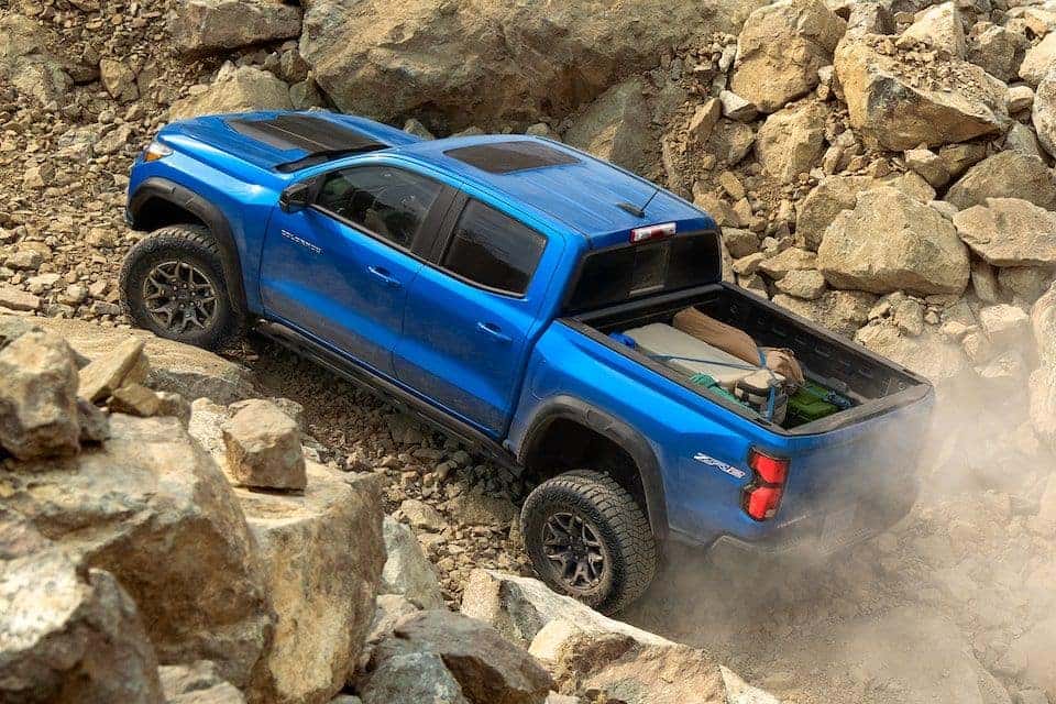 Chevrolet Colorado Off-Roading up a Mountain Top Rear 3/4 View