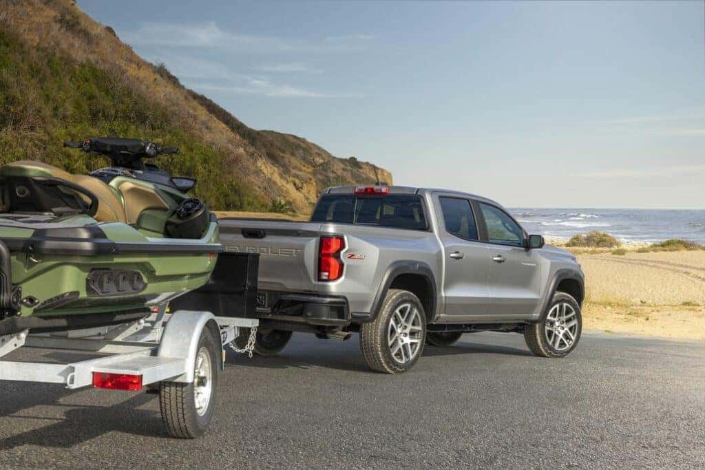Rear 3/4 view of Colorado Z71 towing a personal watercraft.