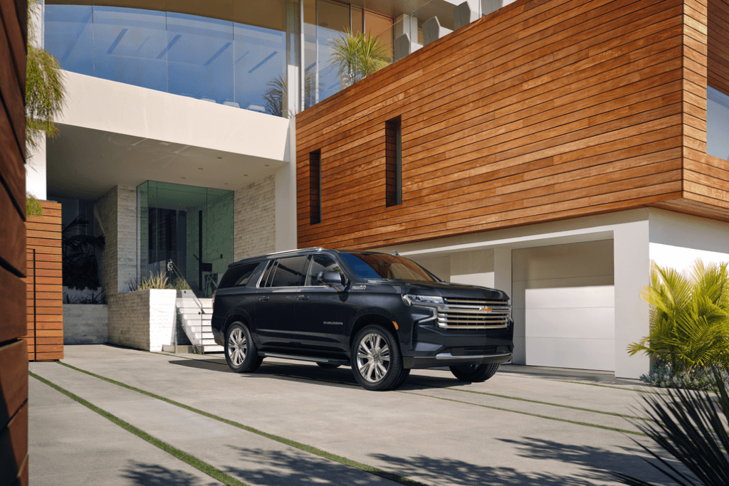 Chevrolet Suburban Parked Front 3/4 View in Front of a Mansion