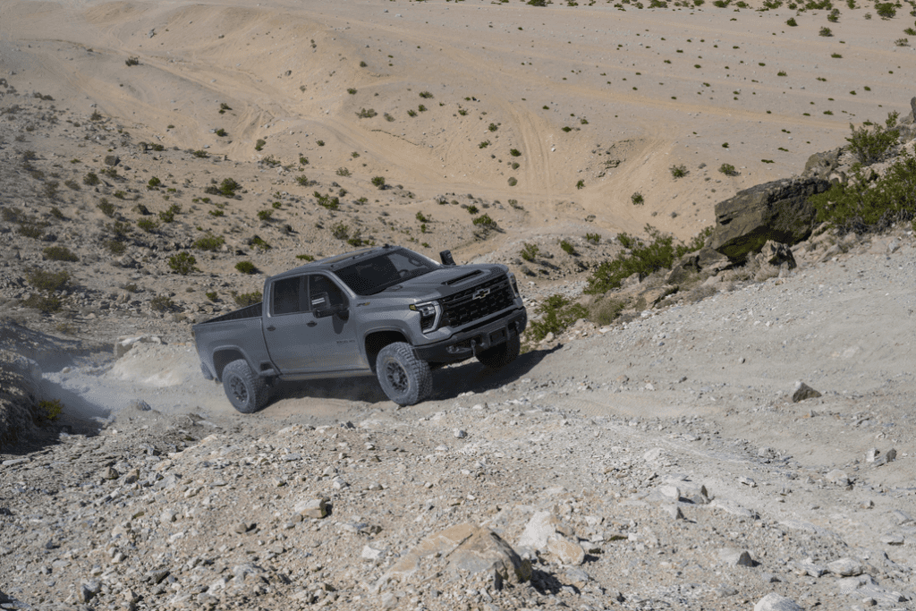 Chevrolet Silverado 2500HD Driving up a Desert Mountain Front 3/4 View