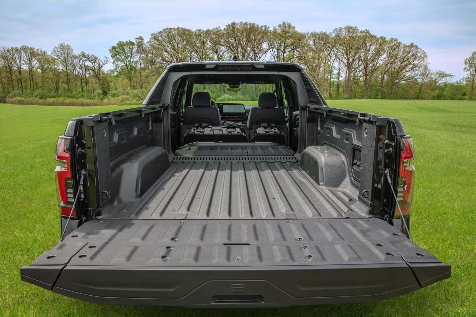 Black 2024 Chevrolet Silverado EV RST with tailgate down