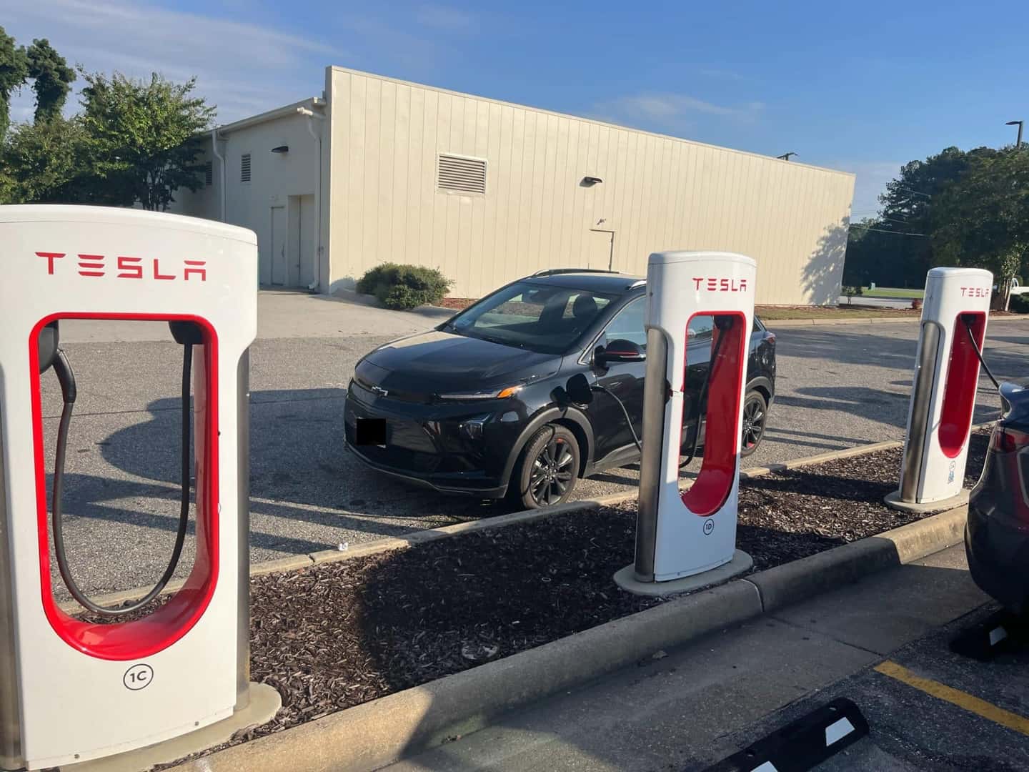 An Efficient Chevy Bolt Charging At A Tesla Supercharger