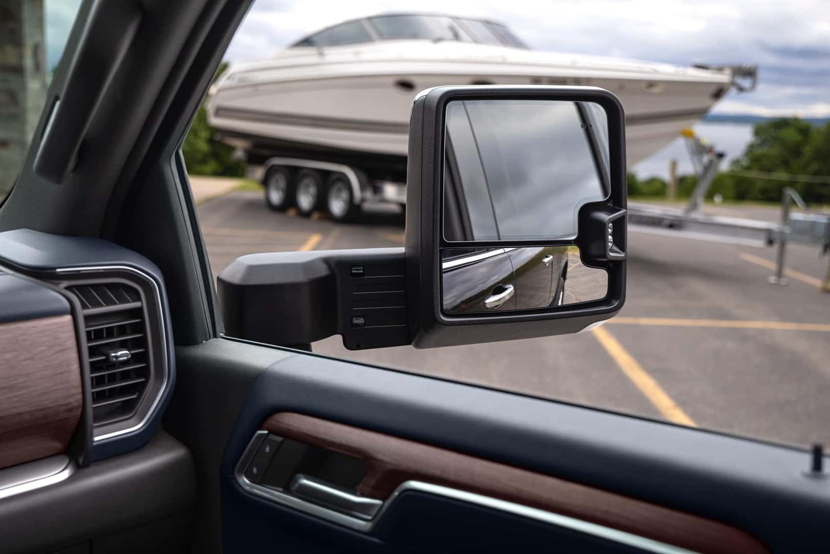 The SIde Mirror Of The Strong 2024 Chevy Silverado HD