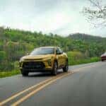 The Affordable 2024 Chevrolet Trax Driving On The Road Poetically