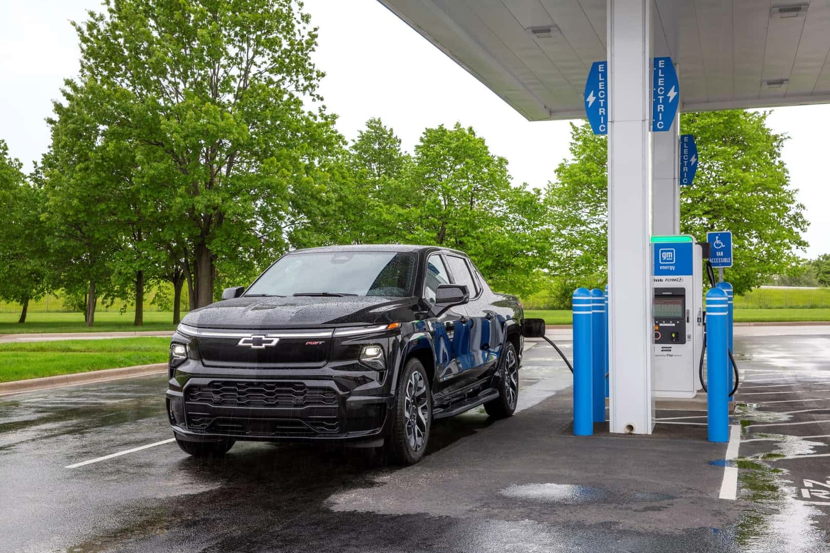 The Stellar 2024 Silverado EV Pulling Up To The Charging Station 